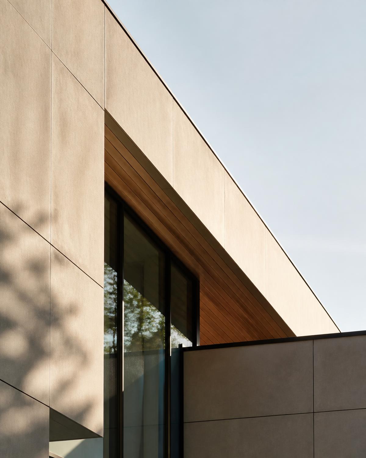 Minimal modern architectural facade in warm afternoon light, representing structure and stability